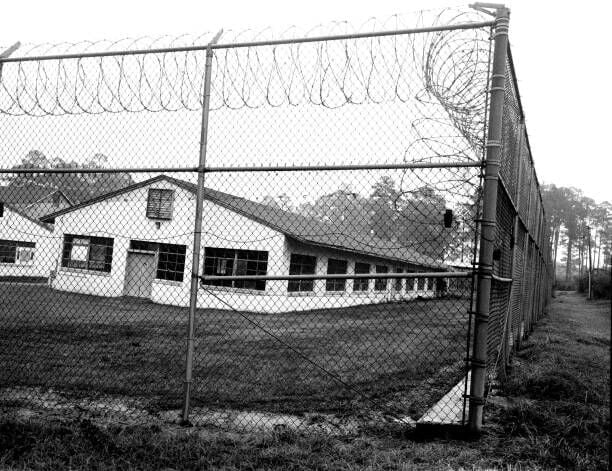 MARIANNA, FLORIDA - CIRCA 2016: (EDITORS NOTE: Image has been shot in black and white. Color version not available.) The now shuttered Dozier School for Boys, a jail for youth in Florida, is a notorious site where many kids died and were buried in unmarked graves, as seen in 2016 , in Marianna, Florida. (Photo by Andrew Lichtenstein/Corbis via Getty Images)