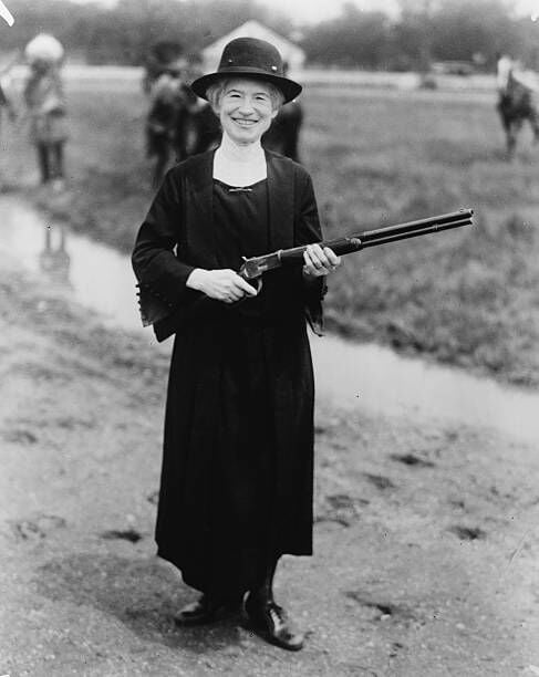 American rodeo star and sharpshooter Phoebe Mozee (1860 - 1926), better known as Annie Oakley holding a gun given to her by Buffalo Bill, 1922. (Photo by  LoC/Epics/Getty Images)