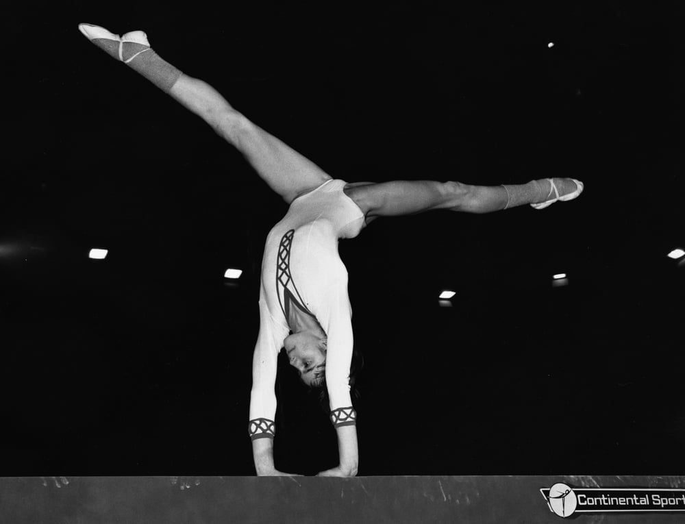 (Original Caption) Nadia Comaneci Working Out On The Beam. A tiny 13 year old Romanian schoolgirl, Nadia Comaneci, is expected to make quite an impact when she competes against some of the world