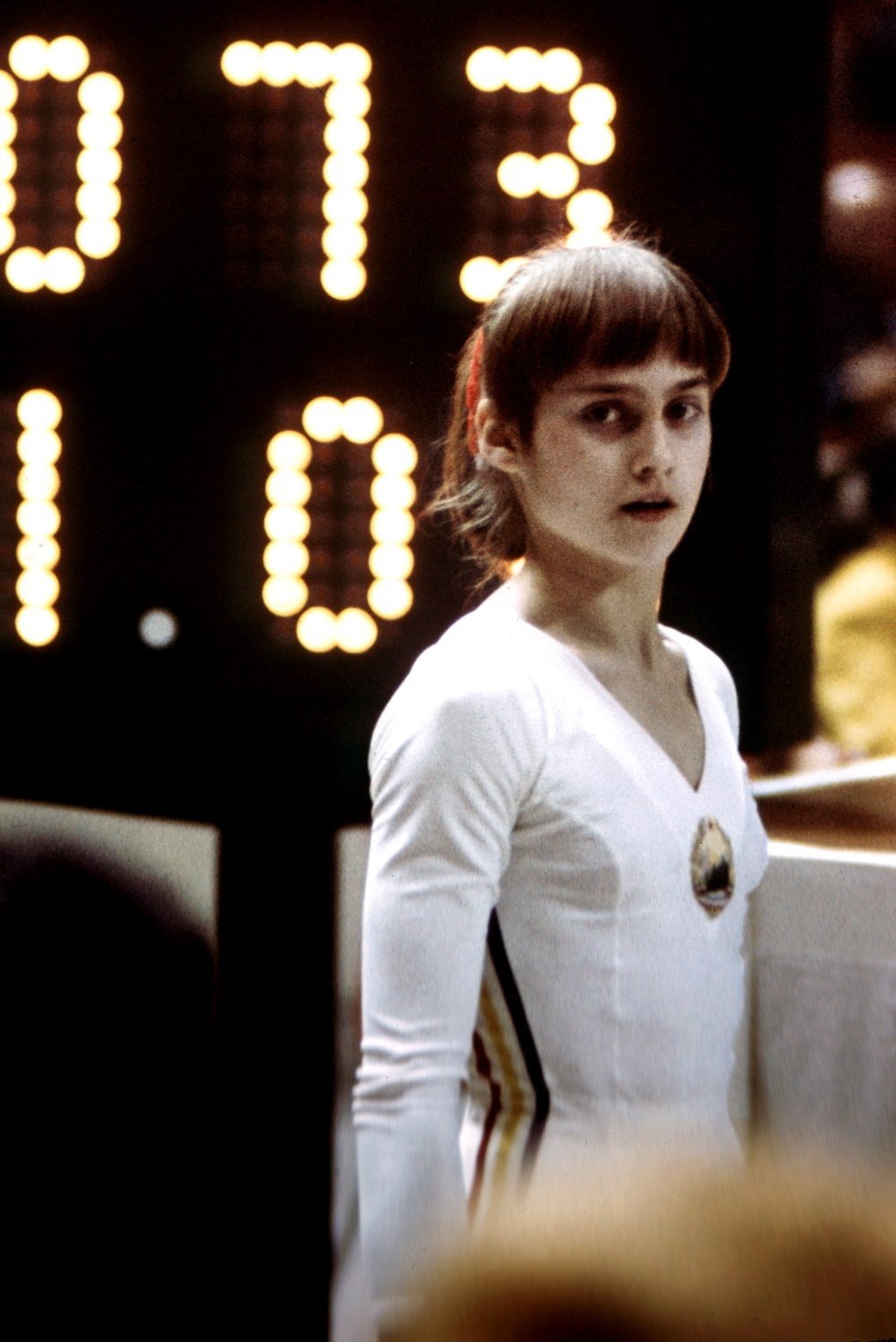 Picture taken 23 July 1976 of Rumanian champion Nadia Comaneci, aged 14, during Olympic Games in Montreal where she was awarded with ten points in two exercices and captured 3 gold medals (beam, uneven bars and general competition). Legendary gymnast, during her career Nadia Comaneci captured four Olympic gold medals (1976 :  beam, uneven bars and general competition - 1980, beam) and was the first to score 10 in her discipline.  (Photo credit should read STAFF/AFP via Getty Images)