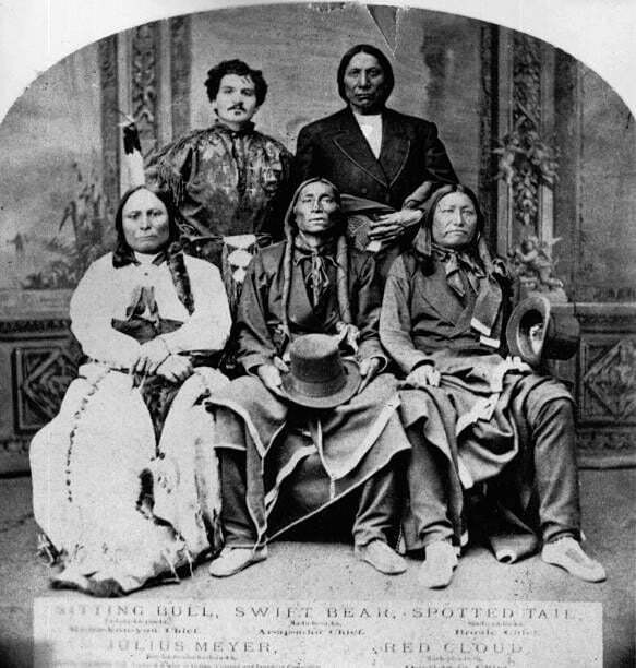 Four Native Americans with their interpreter. Back - Julius Meyer (interpreter) and Red Cloud. Front - Sitting Bull (1834 - 1890), Swift Bear and Spotted Tail. Original Artwork: Original print in sepia.   (Photo by Hulton Archive/Getty Images)