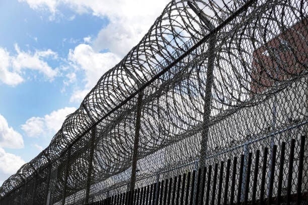 CHICAGO, ILLINOIS - APRIL 09: A fence surrounds the Cook County jail complex on April 09, 2020 in Chicago, Illinois. With nearly 400 cases of COVID-19 having been diagnosed among the inmates and employees, the jail is nation’s largest-known source of coronavirus infections. (Photo by Scott Olson/Getty Images)