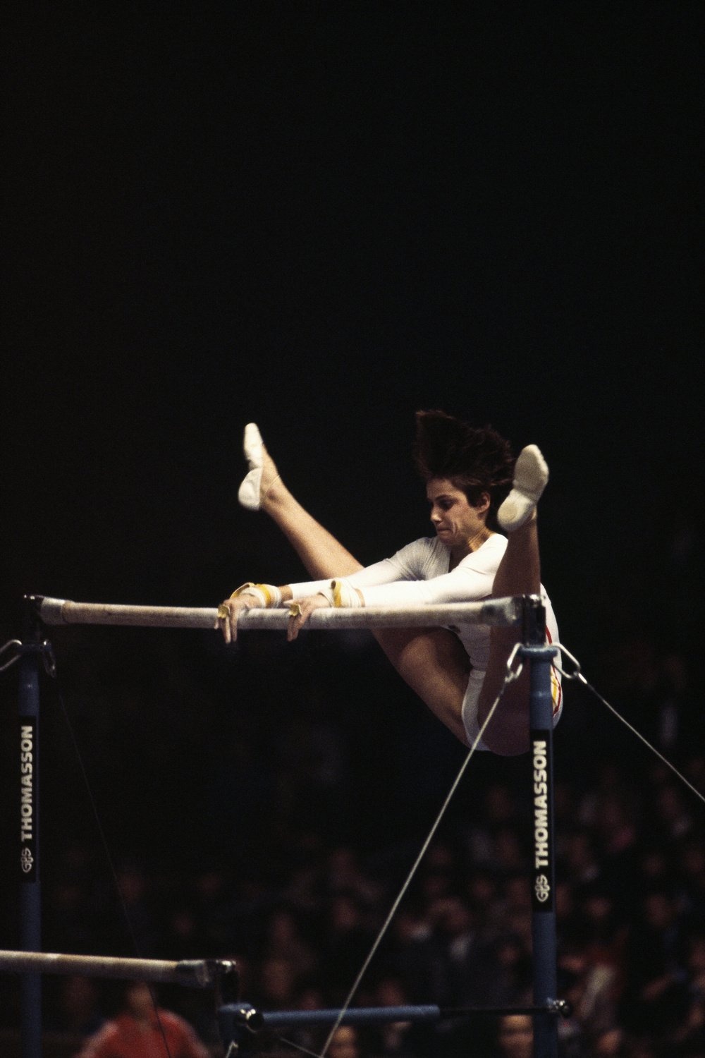 Romanian gymnast Nadia Comaneci performs on the uneven bars during the 1980 Summer Olympics.   (Photo by Jean-Yves Ruszniewski/Corbis/VCG via Getty Images)