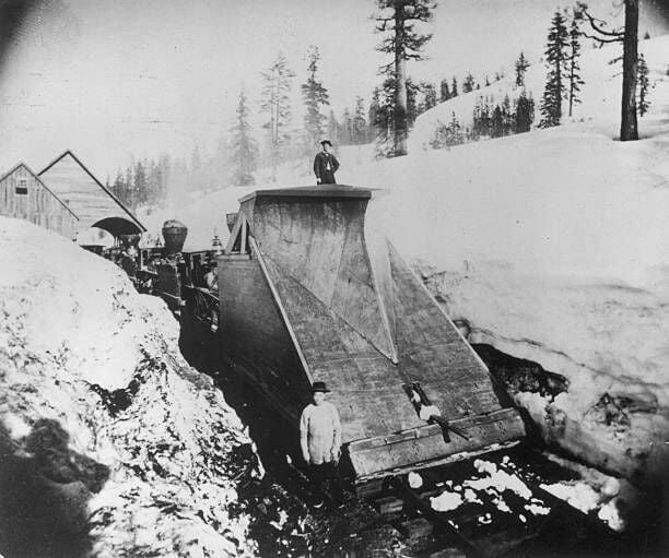 A railway line snow plough in operation during the construction of the Pacific railway in America.   (Photo by Otto Herschan Collection/Hulton Archive/Getty Images)