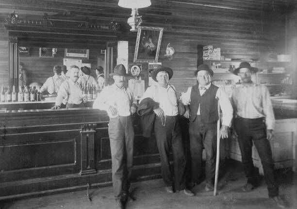 Wild West Saloon Great Signage Ca 1890S - Great Saloon Photograph Of Unknown Western Town. A Couple Of Wild West Cowboys With Two Townspeople And Barkeep Posing In The Saloon. This Image Has Many Advertising Signs, From Milwaukee Brewing, Schlitz, Blatz, And Budweiser, And There Are Cigar Boxes On Shelf. Also In The Mirror On The Opposite Wall You Can See The Bottom Of Custer