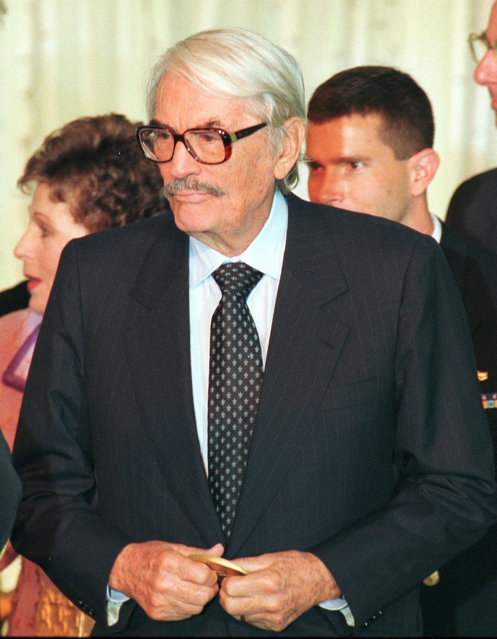Actor Gregory Peck stands holding his National Medal of the Arts award following the ceremony on the South Lawn of the White House, Washington, DC, November 5, 1998. (Photo by Randall Links/Getty Images)