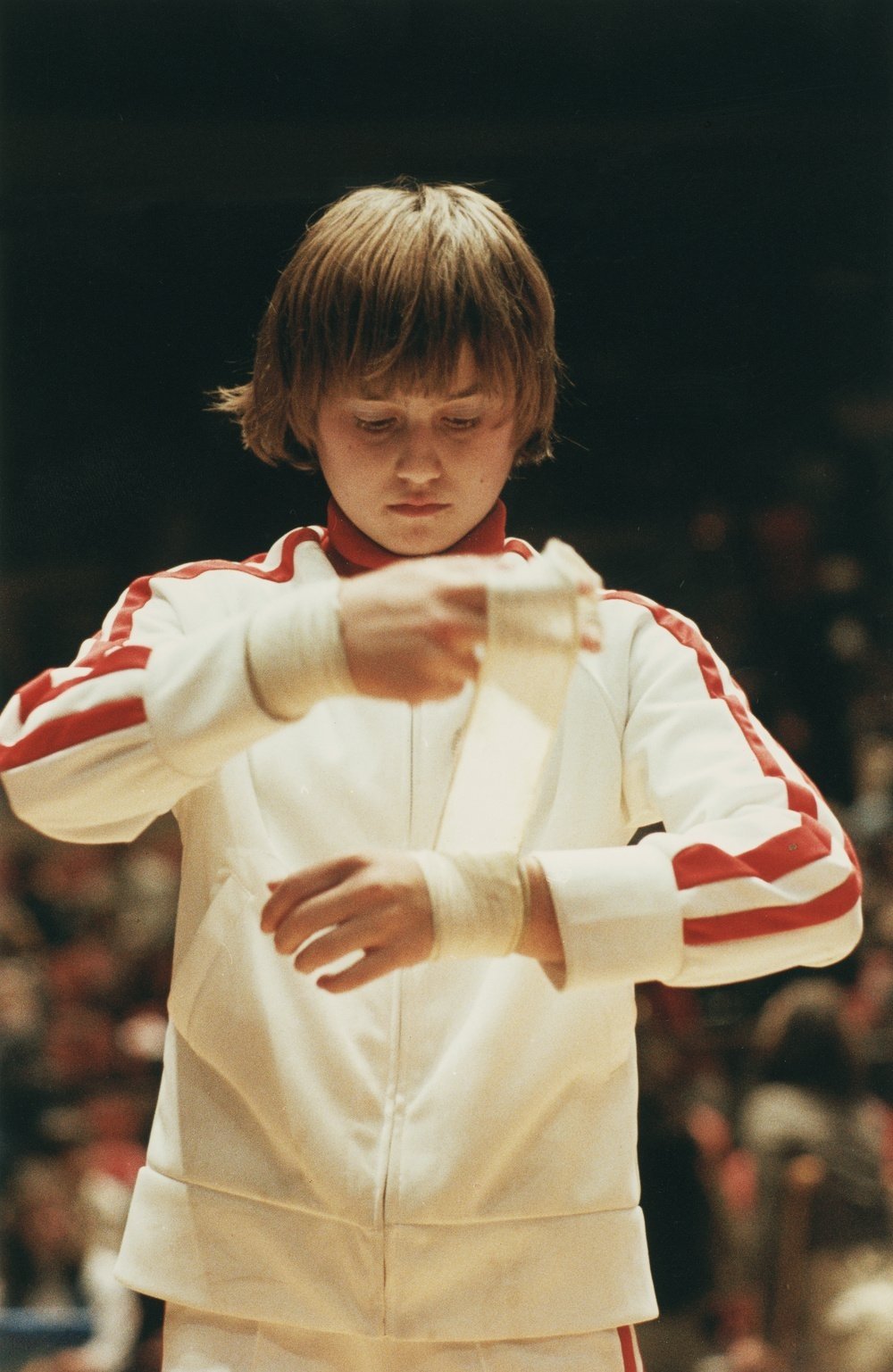 Romanian gymnast Nadia Comaneci wraps a bandage around her wrist prior to competition in the 1979 World Artistic Gymnastics Championships, Fort Worth, Texas, December 1979. (Photo by Robert Riger/Getty Images)
