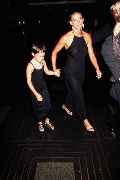 Her head still shaved from her role in G.I. Jane, Demi Moore attends the premiere of Striptease with her daughter Rumer Willis.   (Photo by Mitchell Gerber/Corbis/VCG via Getty Images)