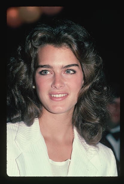 (Original Caption) : 1982-Actress/model Brooke Shields is shown smiling in this head and shoulders portrait.   (Photo by Lynn Goldsmith/Corbis/VCG via Getty Images)