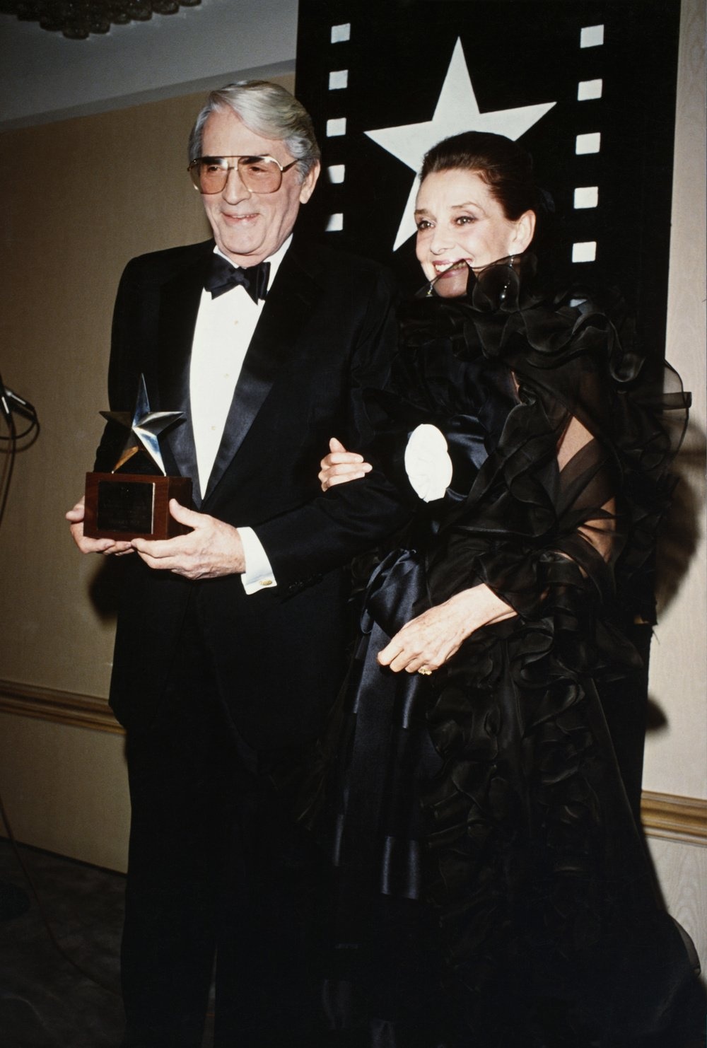 Actor Gregory Peck, seen here with Audrey Hepburn, received the American Film Institute Life Achievement Award in honor of his fifty-year careera . (Photo by Frank Trapper/Corbis via Getty Images)