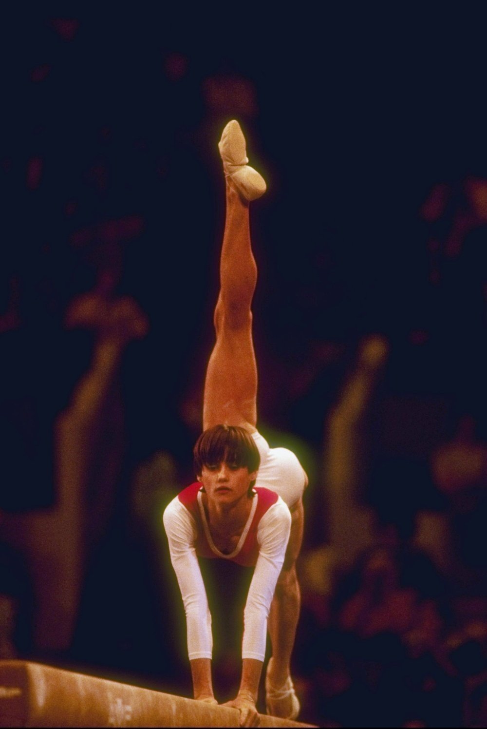 Nadia Comaneci does her routine on the balance beam.