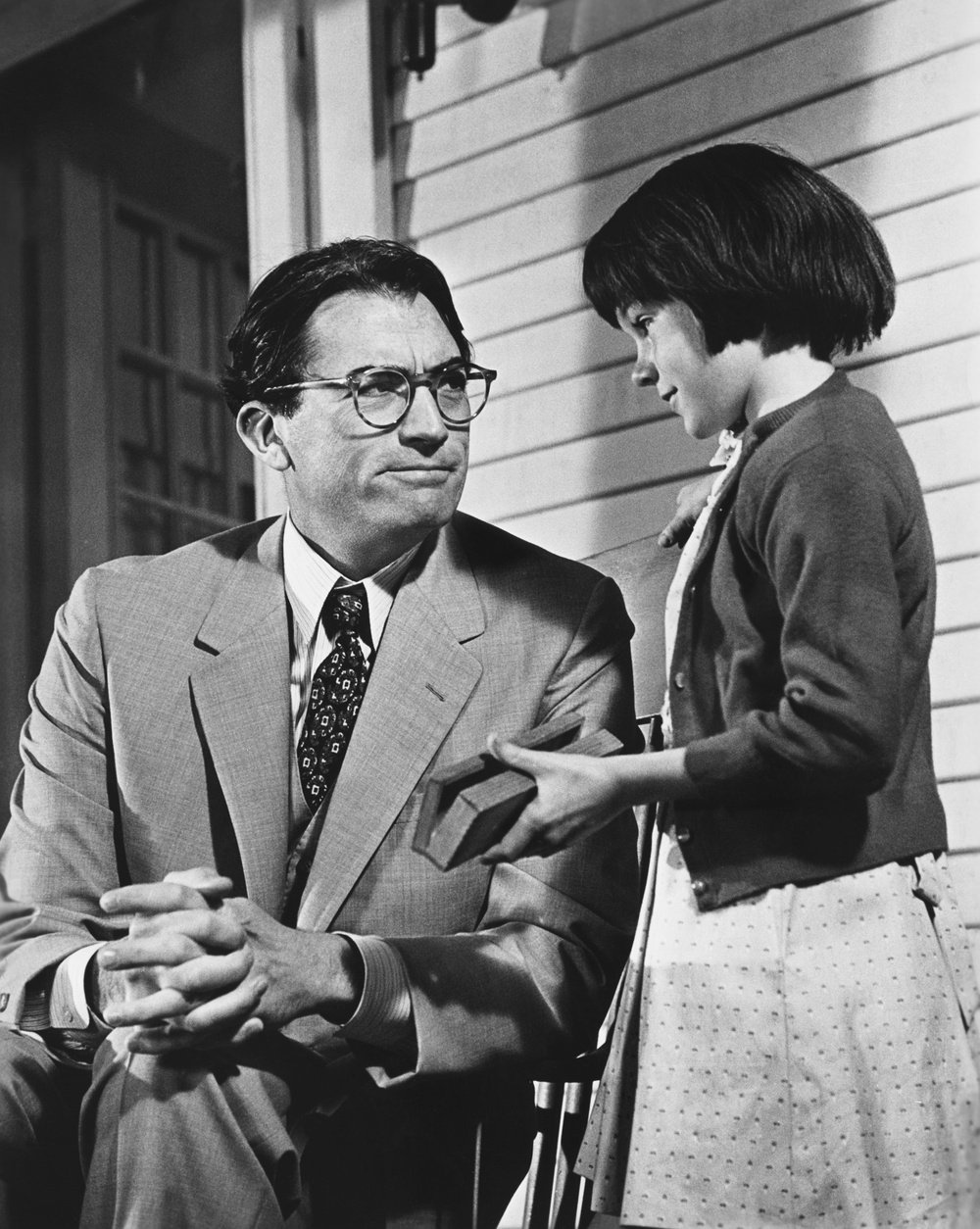 Gregory Peck as Atticus Finch and Mary Badham as Scout Finch in the 1962 film version of Harper Lee